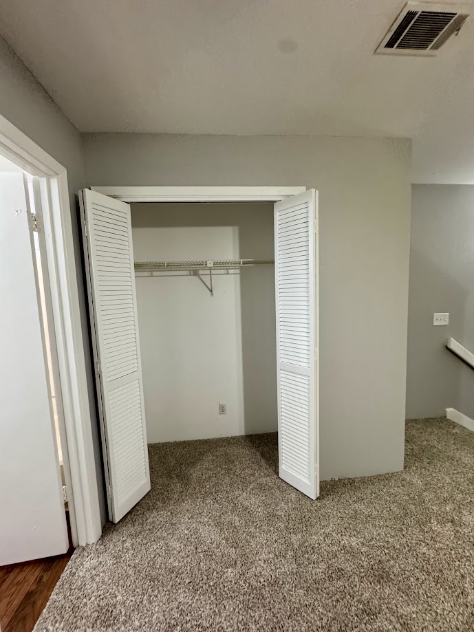 1305 West Villa Maria Road, Unit C107 Bryan, TX 77801 - Photo 18 of 19 an empty room with a door