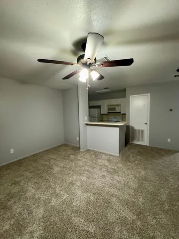 a view of a kitchen with a sink and a stove