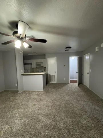 a view of a kitchen with a sink