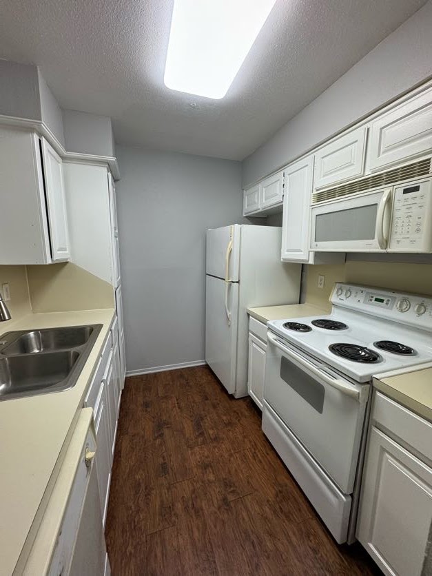 1305 West Villa Maria Road, Unit C107 Bryan, TX 77801 - Photo 9 of 19 a kitchen with a stove and a refrigerator