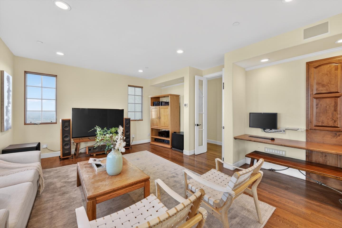 17599 Montebello Road Cupertino, CA 95014 - Photo 13 of 83 a living room with furniture and a flat screen tv