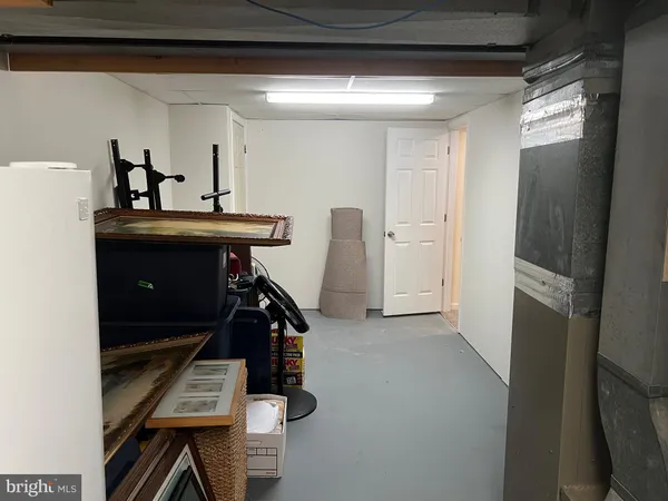 a view of room with furniture and windows