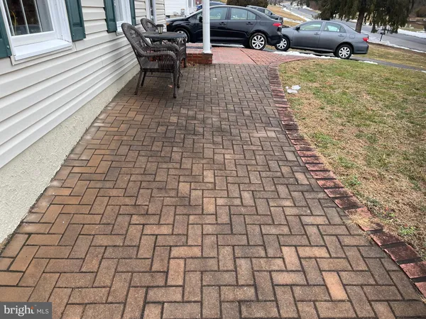a view of a backyard with sitting area