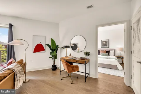 a view of a workspace with furniture and entryway