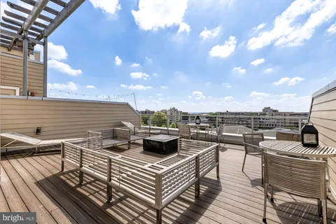 a view of a terrace with seating area