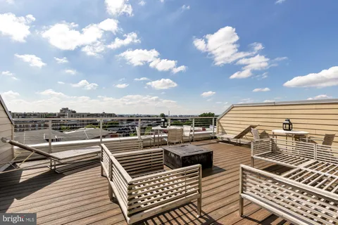 a view of a balcony with wooden floor