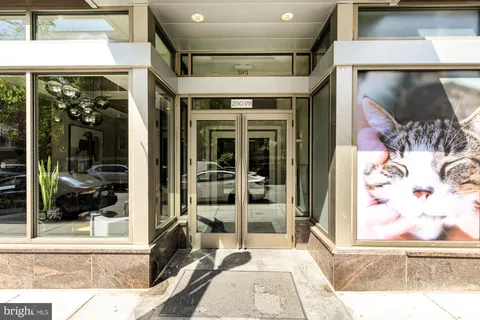 a view of a entryway door of the building and living room