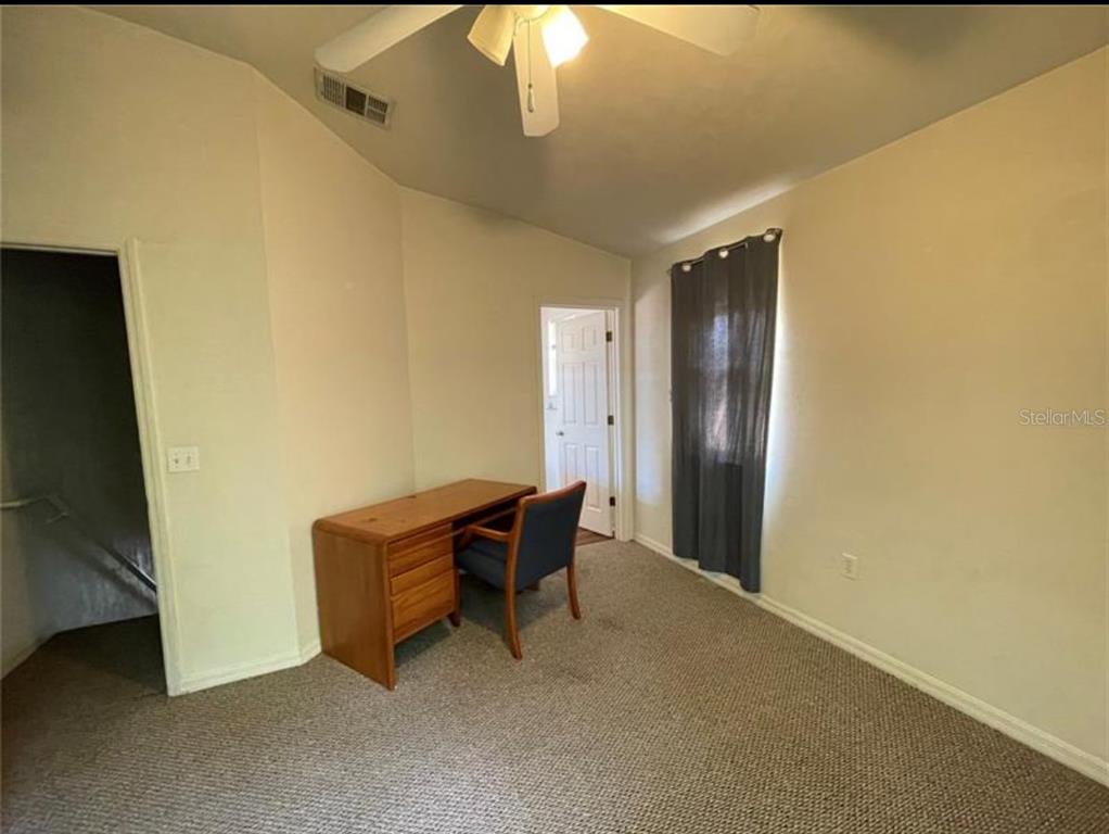 3860 Southwest 20th Avenue, Unit 1801 Gainesville, FL 32607 - Photo 11 of 19 a view of room with furniture and wooden door