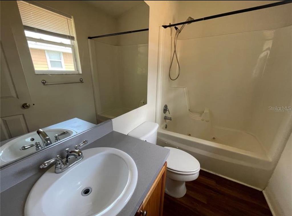 3860 Southwest 20th Avenue, Unit 1801 Gainesville, FL 32607 - Photo 13 of 19 a bathroom with a sink toilet and shower