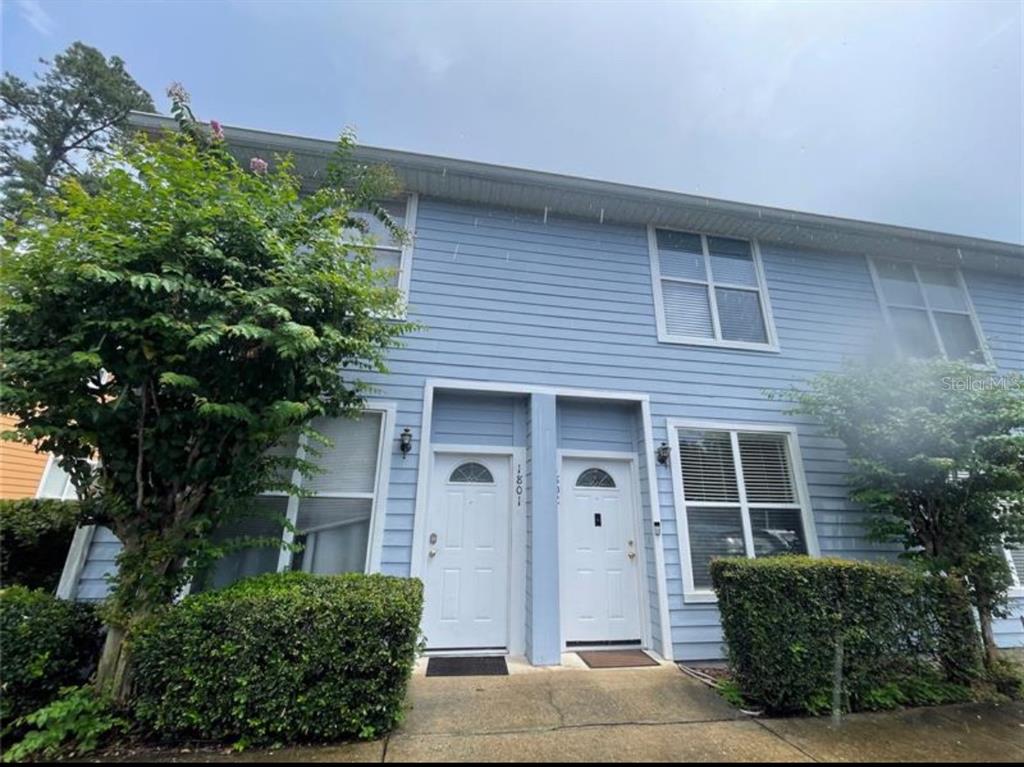 3860 Southwest 20th Avenue, Unit 1801 Gainesville, FL 32607 - Photo 16 of 19 a front view of a house with a garden