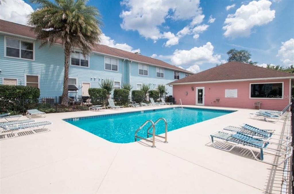 3860 Southwest 20th Avenue, Unit 1801 Gainesville, FL 32607 - Photo 17 of 19 a view of house with outdoor space and swimming pool