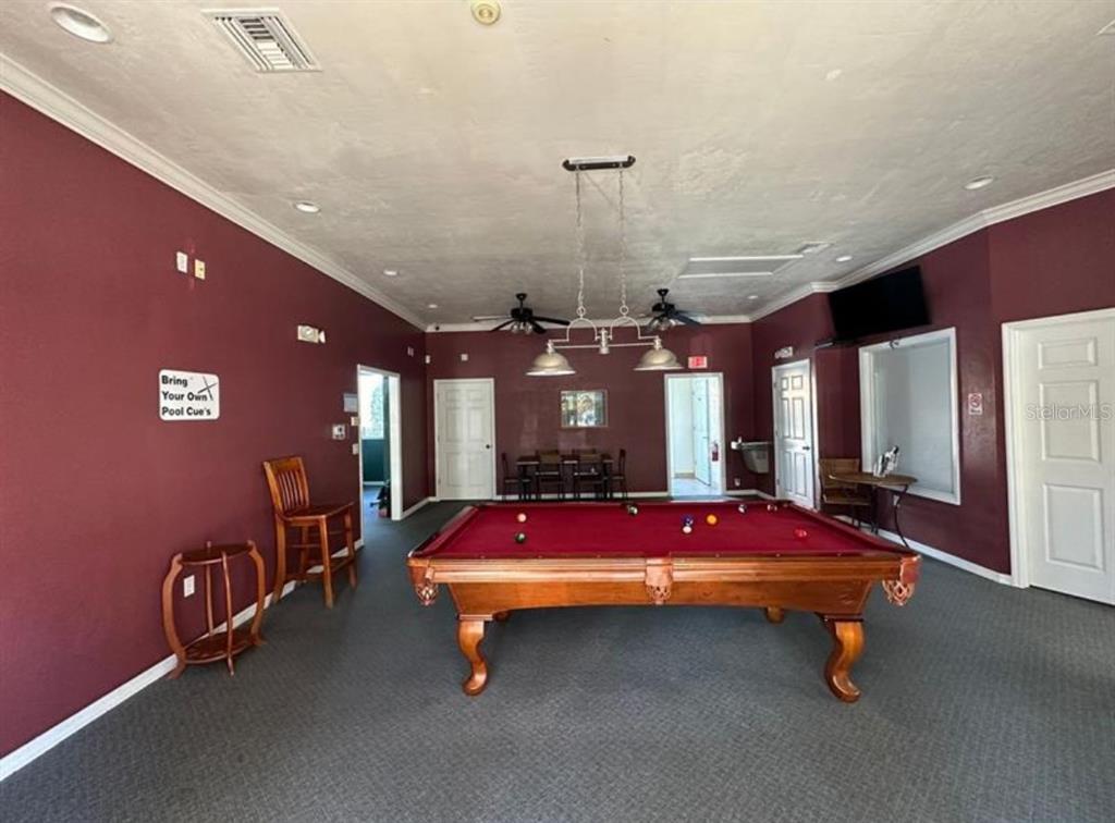 3860 Southwest 20th Avenue, Unit 1801 Gainesville, FL 32607 - Photo 18 of 19 a bedroom with pool table and windows
