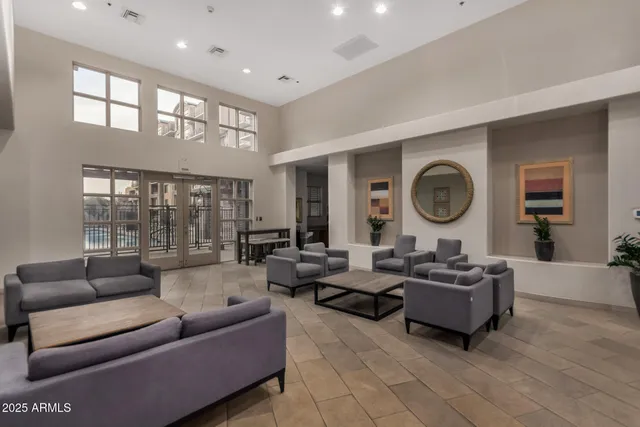 a living room with furniture and a large window