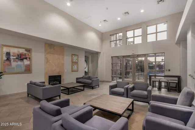 a living room with furniture and a large window