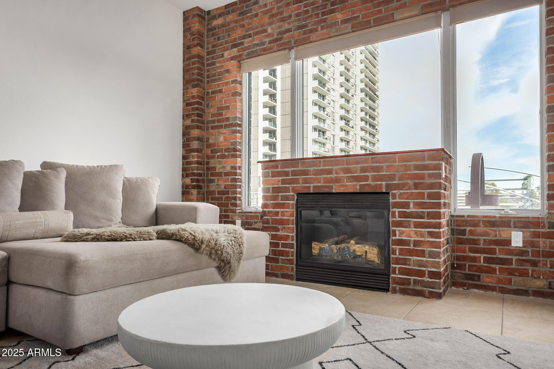 2302 North Central Avenue, Unit 206 Phoenix, AZ 85004 - Photo 5 of 35 a living room with furniture and a fireplace