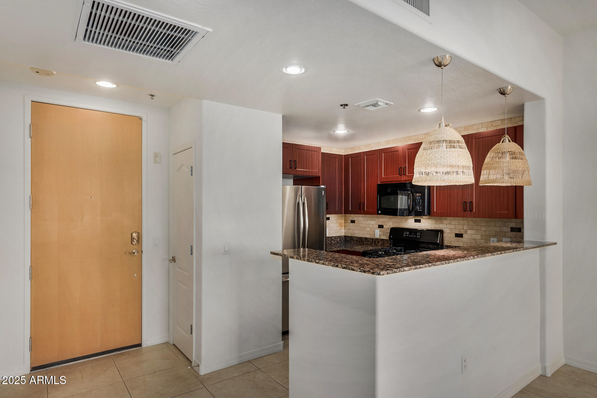 2302 North Central Avenue, Unit 206 Phoenix, AZ 85004 - Photo 8 of 35 a kitchen with stainless steel appliances granite countertop a refrigerator a sink and a stove