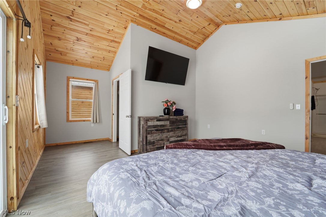 5919 Lake Road West, Unit 33 Ashtabula, OH 44004 - Photo 17 of 22 Bedroom with a vaulted wood ceiling and light wood-style floors