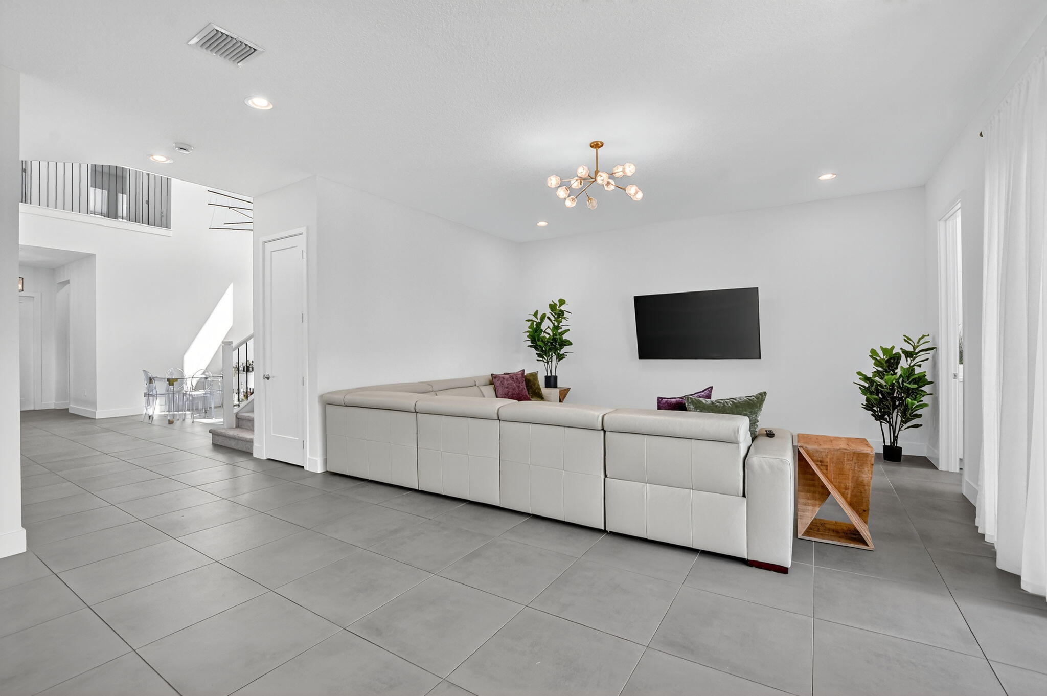 8284 Royal County Down Road Boca Raton, FL 33434 - Photo 14 of 121 a living room with furniture and a flat screen tv