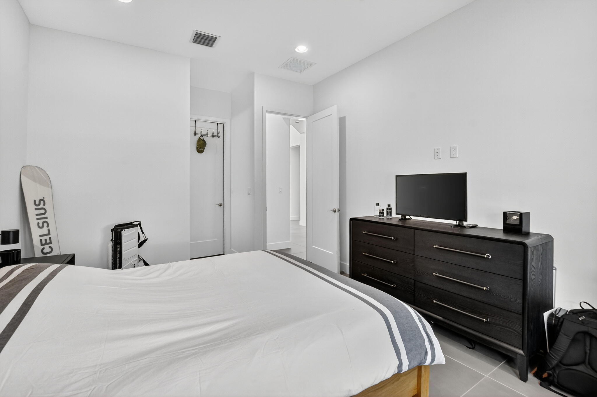 8284 Royal County Down Road Boca Raton, FL 33434 - Photo 29 of 121 a bedroom with a bed and a flat screen tv