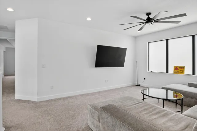 an aerial view of a house with a lake view