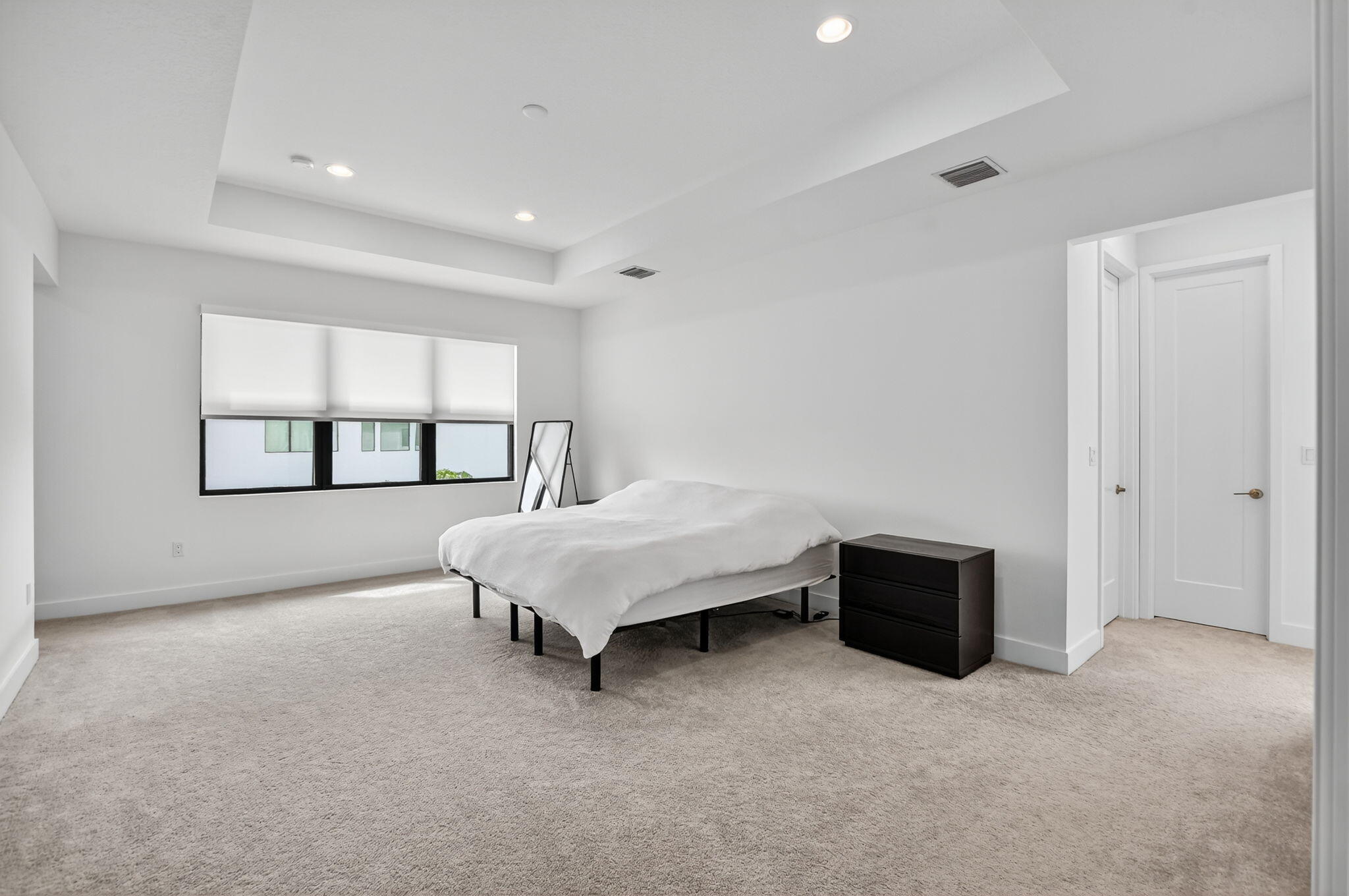 8284 Royal County Down Road Boca Raton, FL 33434 - Photo 36 of 121 a spacious bedroom with a bed and a window