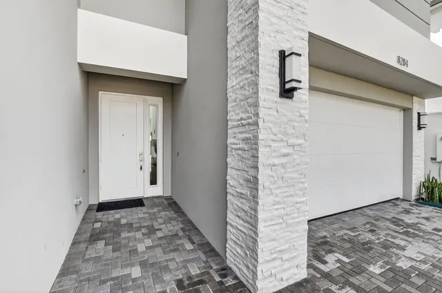 a living room with furniture a rug and a window