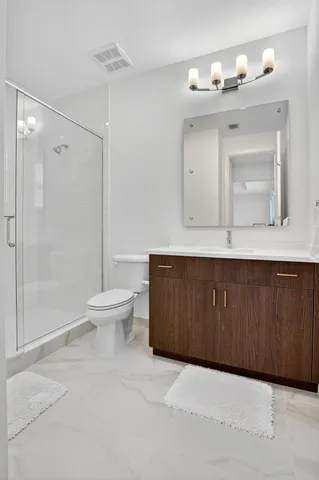 a living room with patio furniture and a large window