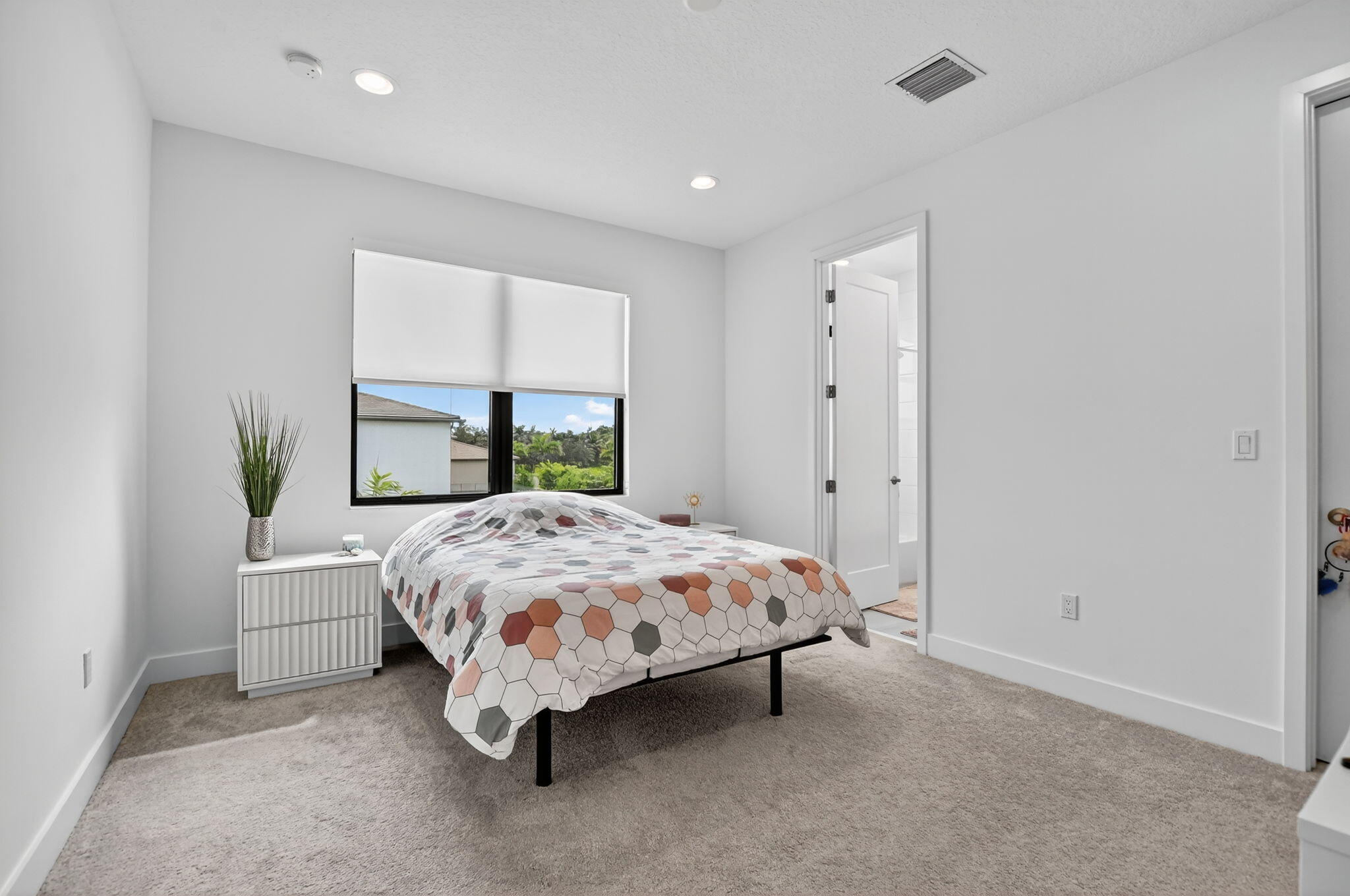 8284 Royal County Down Road Boca Raton, FL 33434 - Photo 45 of 121 a bed sitting in a spacious bedroom next to a window