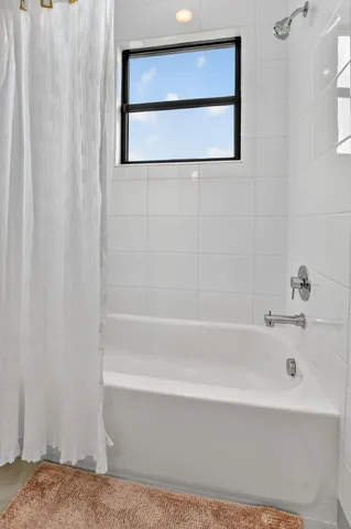 an aerial view of a houses with outdoor space and street view