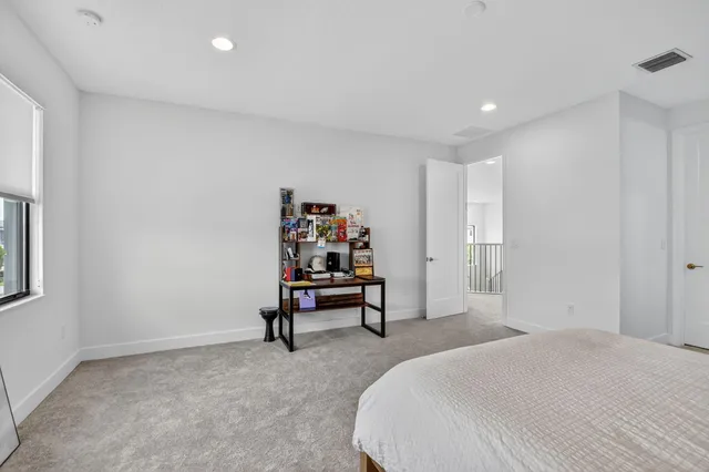 an aerial view of multiple houses with yard