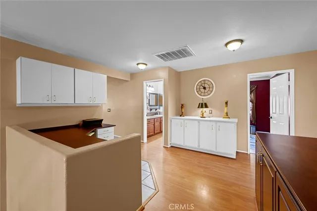 a view of a room with cabinet and flat screen tv