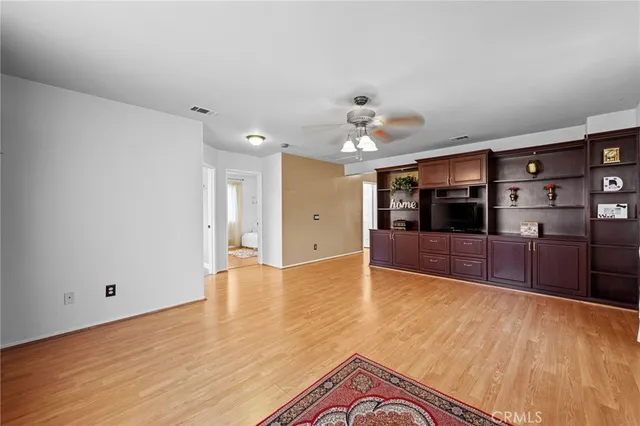 a spacious bathroom with a double vanity sink a large mirror and a bathtub