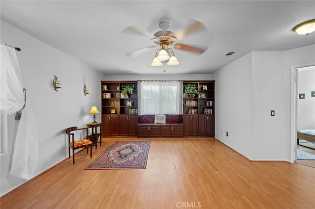 a bathroom with a tub a double vanity sink and a large mirror