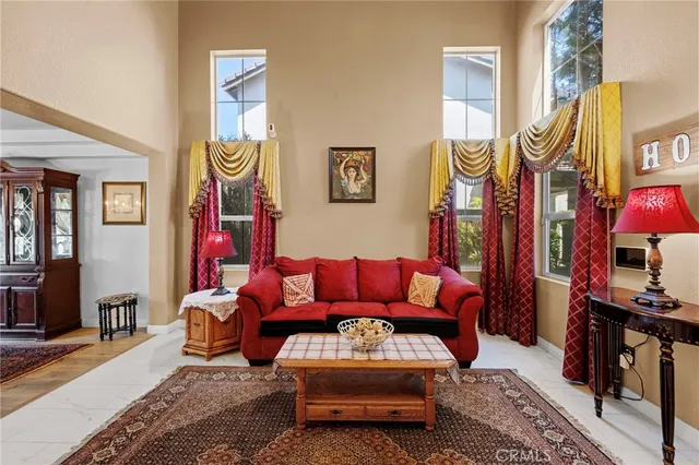 a living room with furniture and a rug