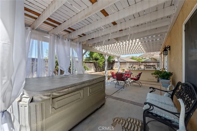 a front view of a house with a yard and fountain in middle