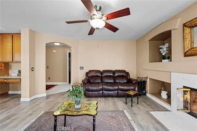 a kitchen with stainless steel appliances granite countertop a sink a stove and a wooden floors