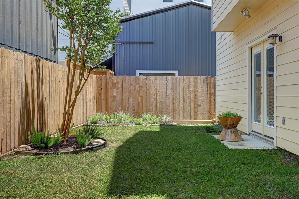2416 Bevis Street Houston, TX 77008 - Photo 1 of 15 a garden with wooden fence