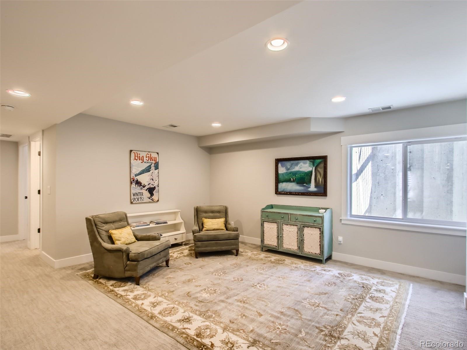 303 Alton Way Denver, CO 80230 - Photo 22 of 35 a living room with furniture and window