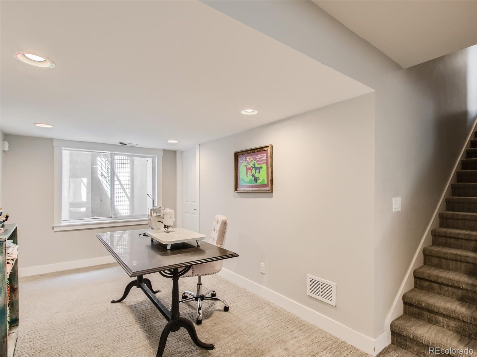 303 Alton Way Denver, CO 80230 - Photo 26 of 35 a view of a livingroom with furniture and wooden floor