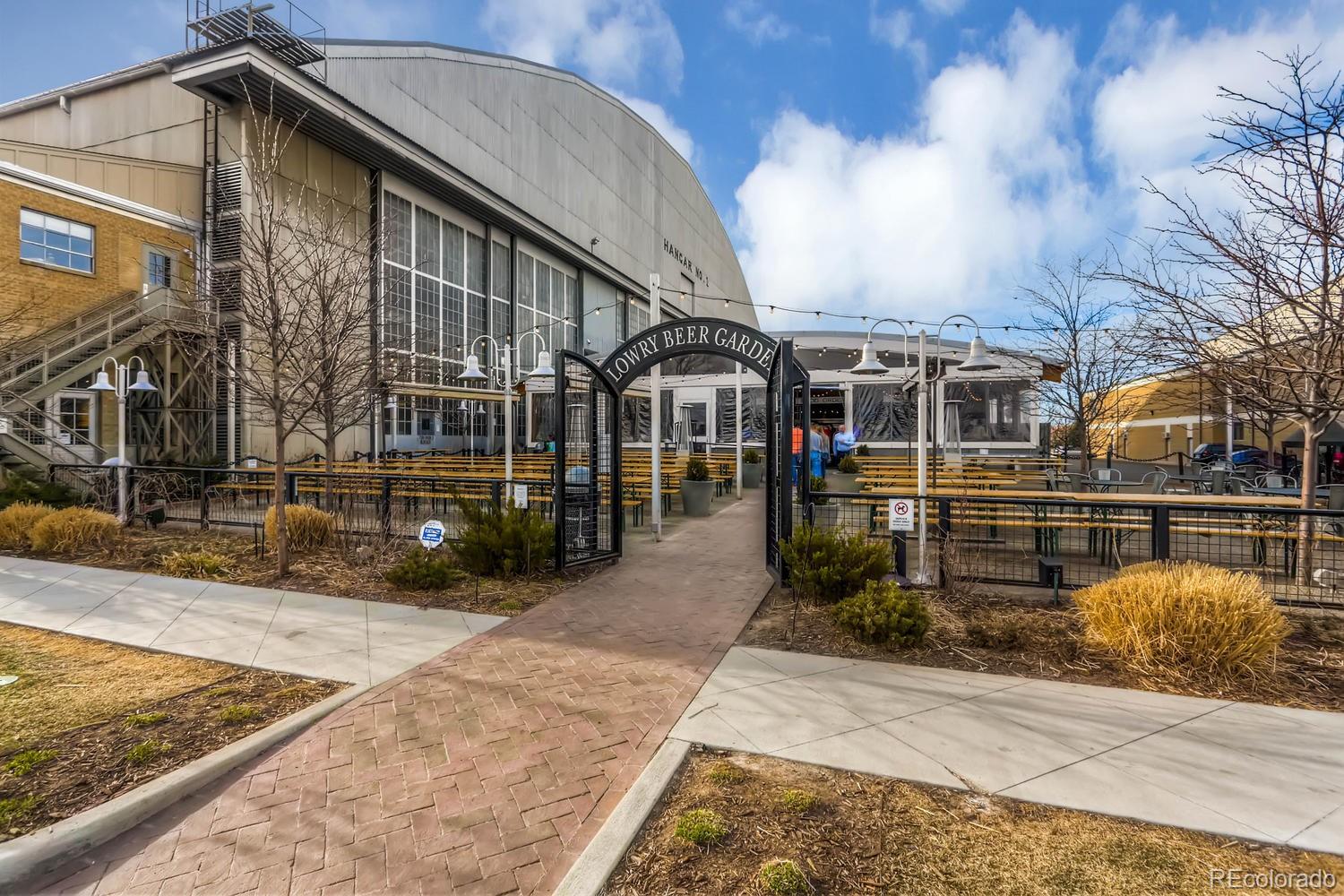 303 Alton Way Denver, CO 80230 - Photo 30 of 35 a view of a house with street next to a road