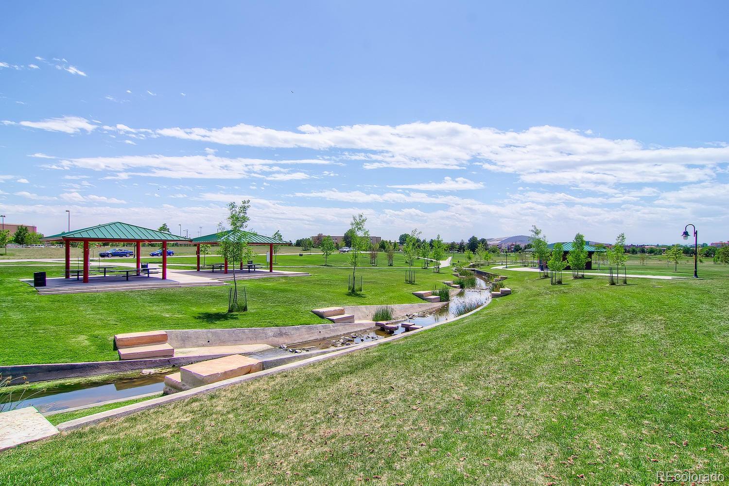 303 Alton Way Denver, CO 80230 - Photo 33 of 35 a view of a big yard with plants and large trees