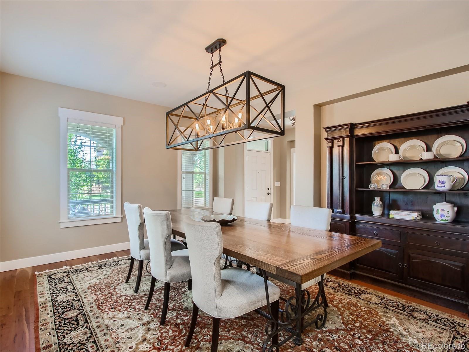 303 Alton Way Denver, CO 80230 - Photo 9 of 35 a view of a dining room with furniture and a table