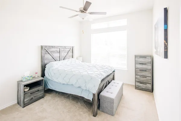 a bedroom with a bed and a cabinets