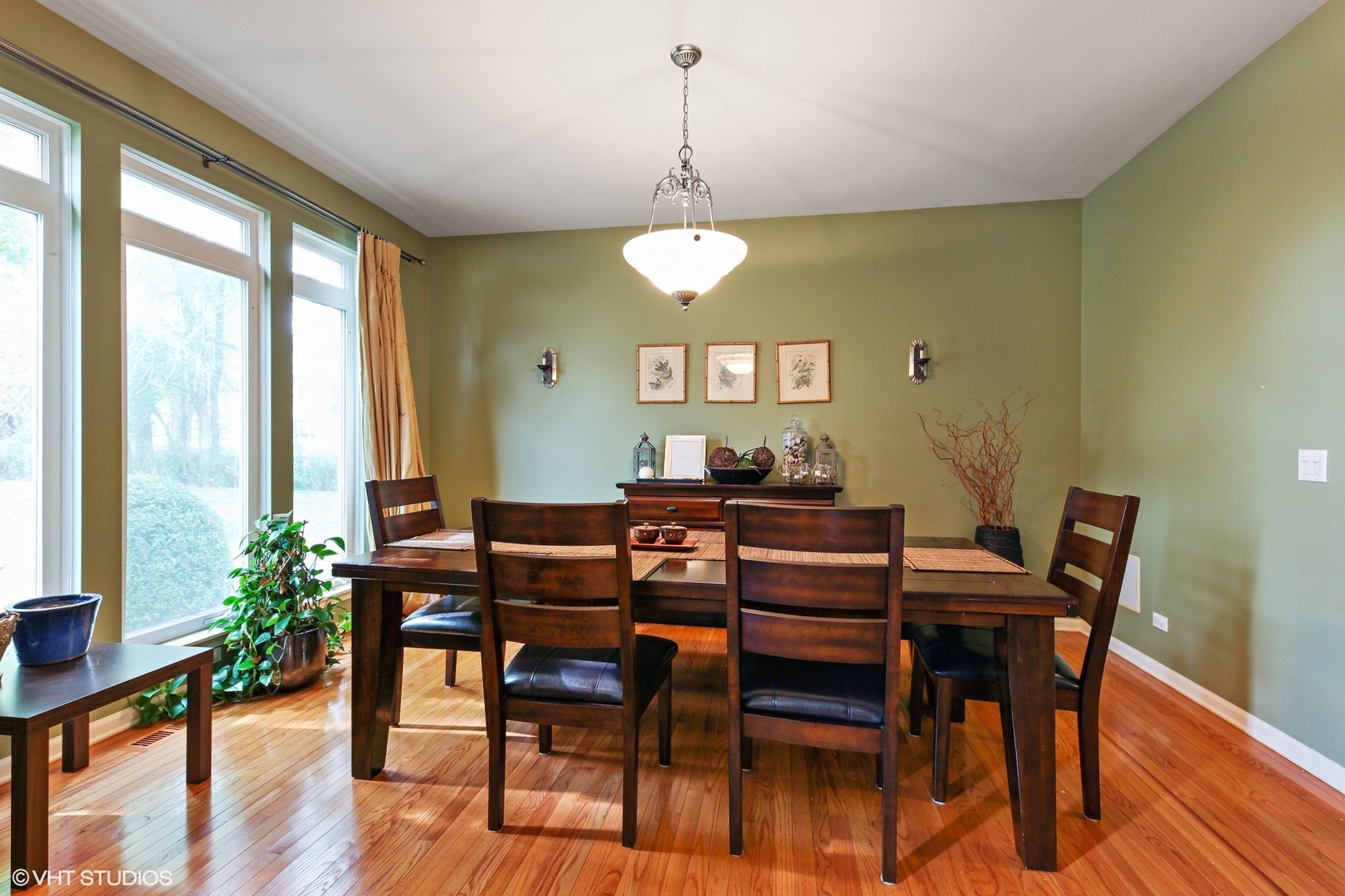 800 De Roo Loop Highwood, IL 60040 - Photo 5 of 22 a view of a dining room with furniture window and wooden floor