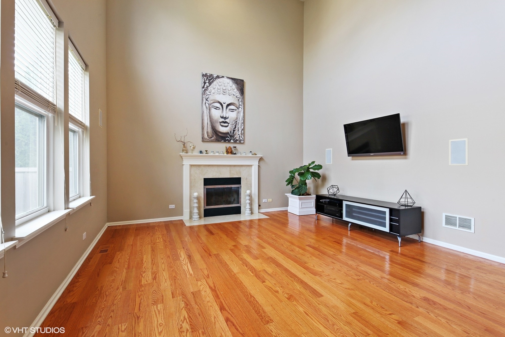 800 De Roo Loop Highwood, IL 60040 - Photo 6 of 22 a view of livingroom with furniture flat screen tv and wooden floor