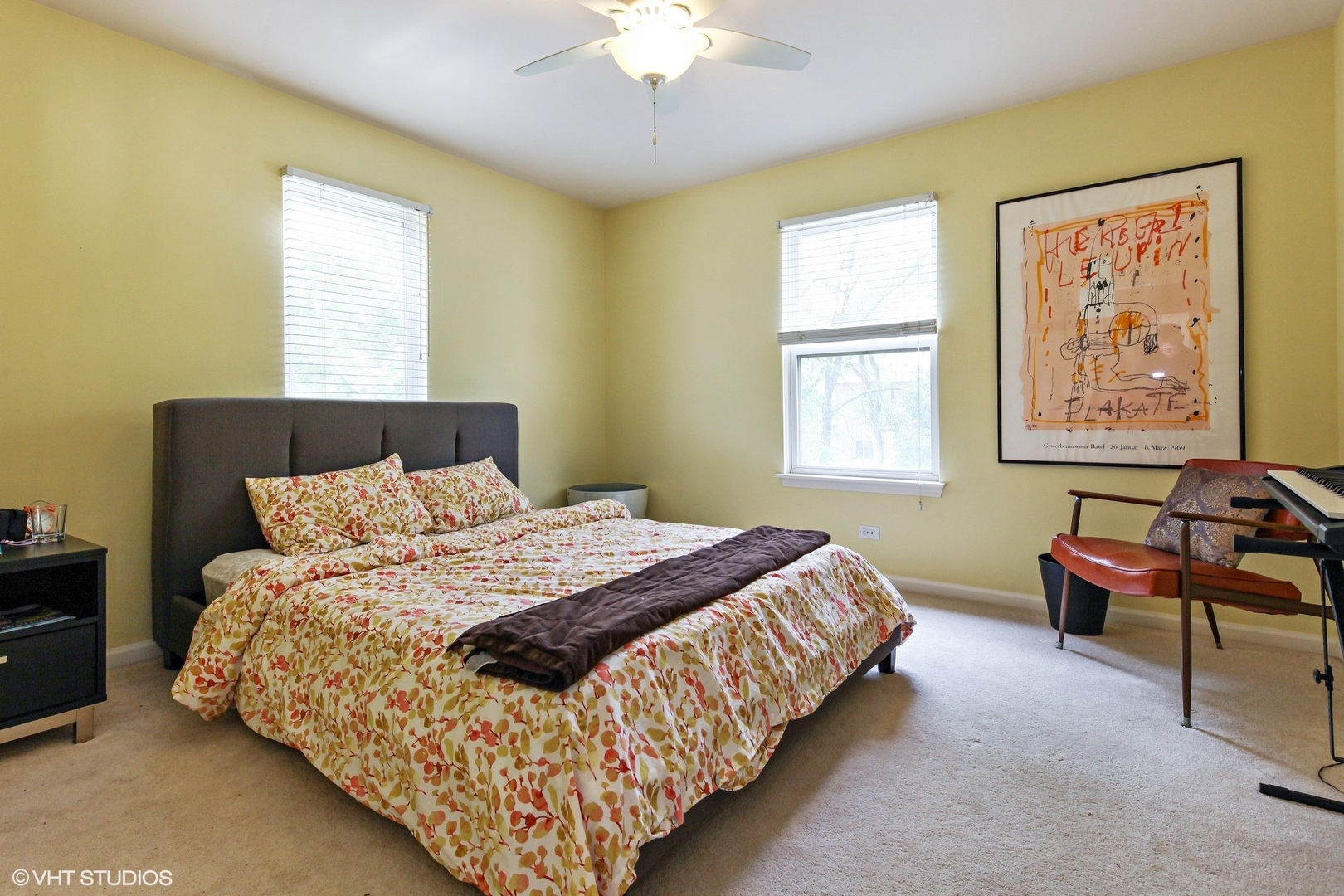 800 De Roo Loop Highwood, IL 60040 - Photo 10 of 22 a bedroom with bed and a chandelier