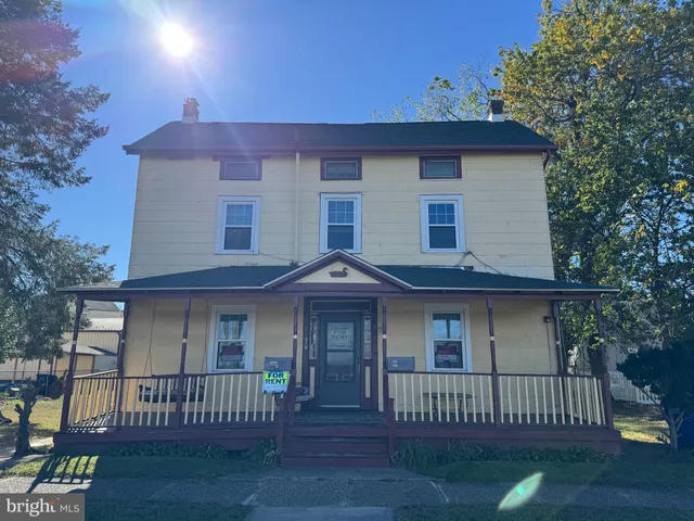 a front view of a house with a porch