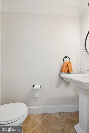 a bathroom with a toilet and a sink