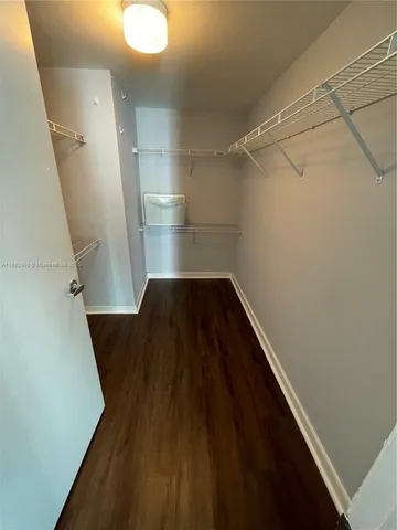 a view of a hallway view with staircase