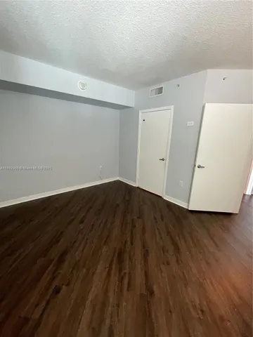 a view of small space with wooden floor